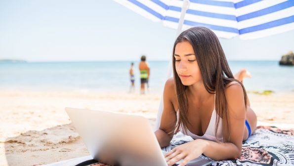 laptop on the beach, tv on the go